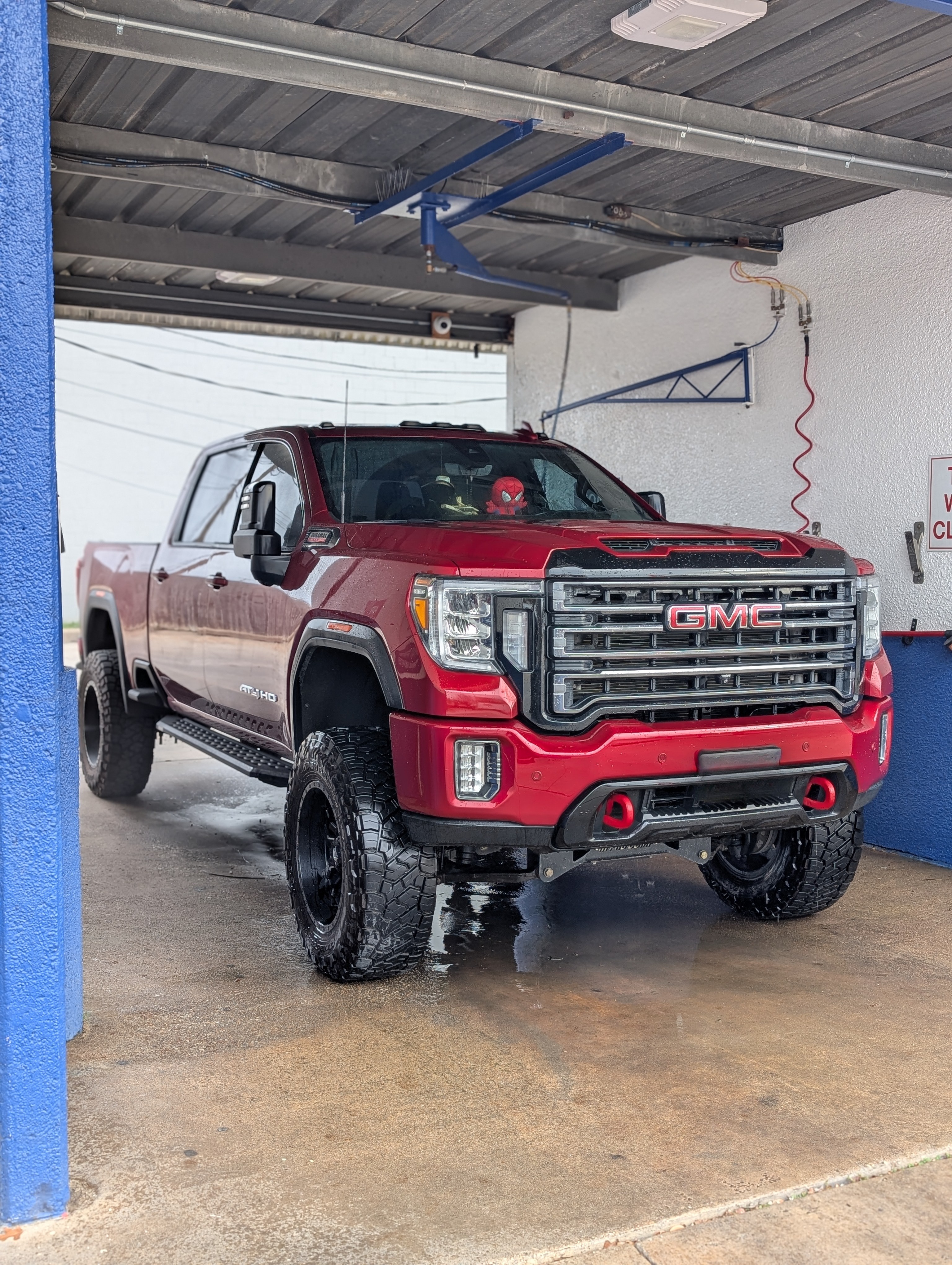 Lifted GMC truck at Spartan Suds